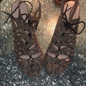 Strapped snakeskin sandals